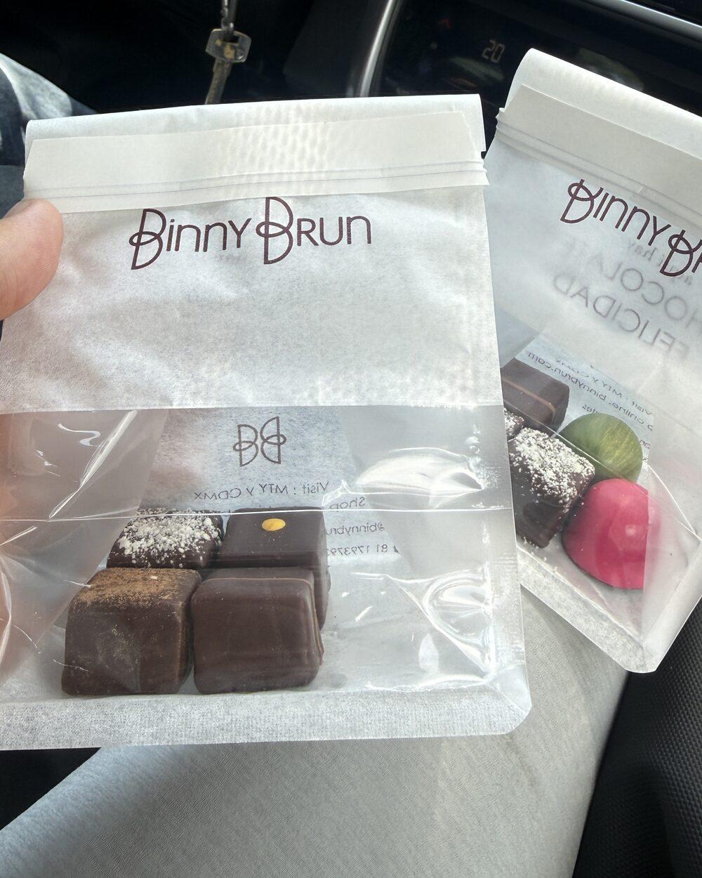 Phone photo of two bags of handmade chocolates just bought in a shop