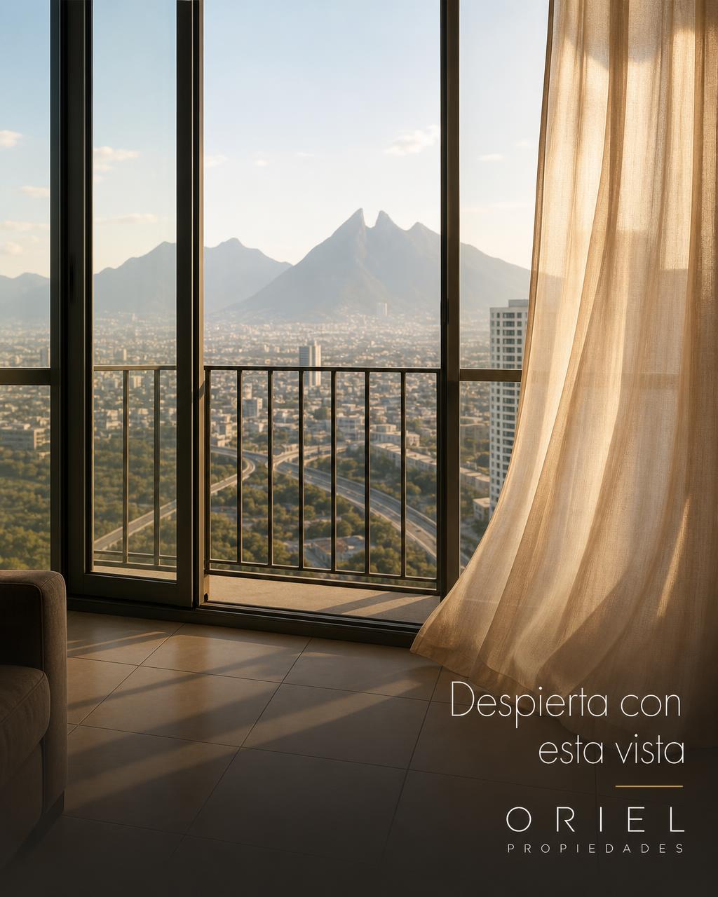 Detail of the open window leading to the balcony, with a moving curtain and the mountain in the background